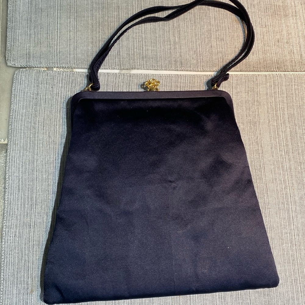 Never used. Vintage navy purse with coin purse and mirror! Great for prom